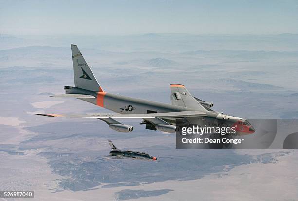 Drops an X-15 rocket plane after carrying it to launching altitude for a test flight over Edwards Air Force Base in California. The X-15 rocket...
