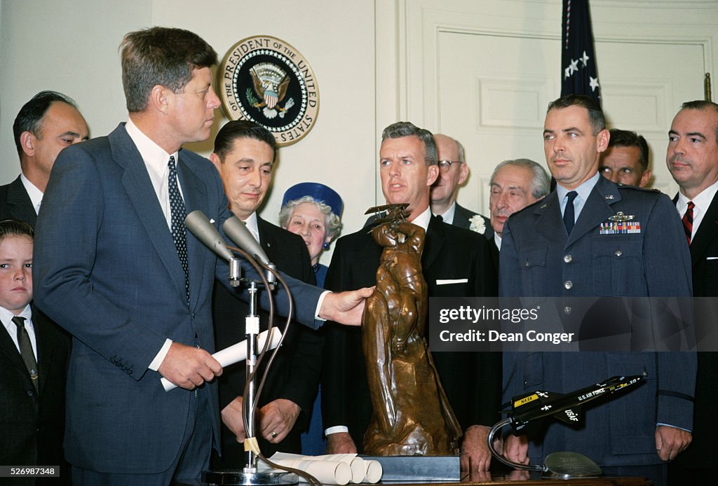 President Kennedy Awarding Trophy to NASA