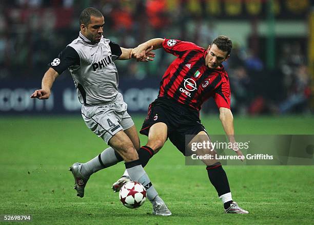 Andriy Shevchenko of AC Milan battles for the ball with Alex of PSV Eindhoven during the UEFA Champions League Semi Final First Leg match between AC...