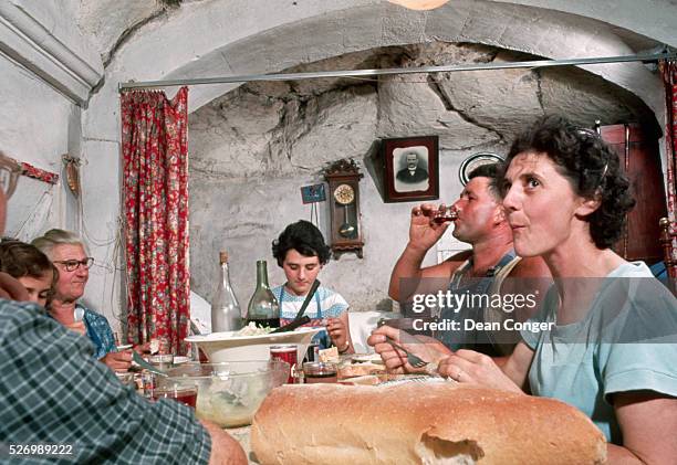 Family Eating Dinner in Their Cave Home