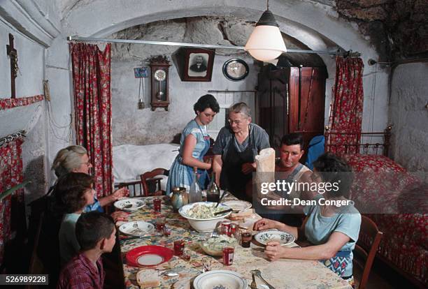 Family Eating Dinner in Their Cave Home