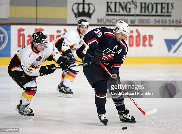 Sebastian Furchner of Germany competes with Doug Weight of the USA during The International Friendly Ice Hockey match between Germany and USA at The...