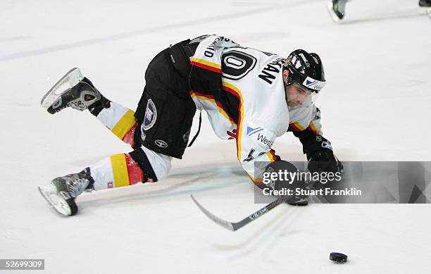 Klaus Kathan of Germany tries to regain control during The International Friendly Ice Hockey match between Germany and USA at The Olympic Stadium on...