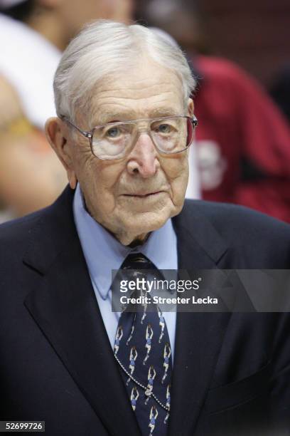 Former UCLA Bruins head coach John Wooden looks on after the game against the Boston College Eagles on December 5, 2004 at The Arrowhead Pond in...