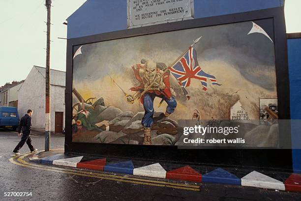 This unionist mural, of a skeleton soldier carrying a union jack through a battlefield, reflects the strong animosity many unionists feel towards the...