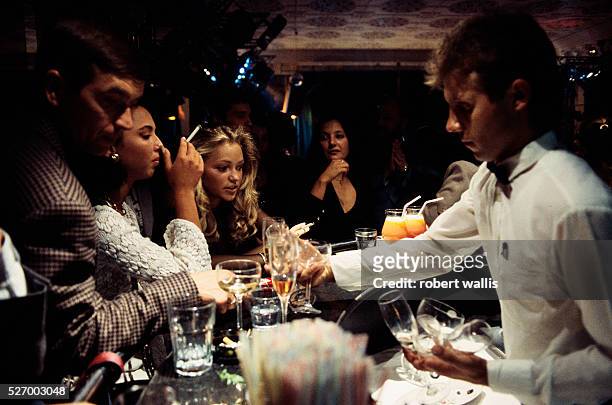 Young people drinking at The Firebird hard-currency night club and casino in Moscow.