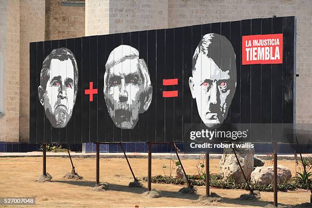 An anti-Bush billboard reads: Bush plus Luis Posada Carriles equals Hitler. Carriles is an anti-Castro Cuban and former CIA operative released from a...
