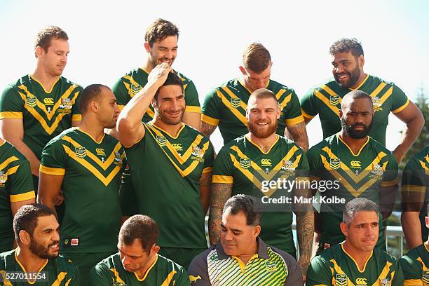 James Tamou fixes his hair as he and his team mates prepare for the team photo during the Australia Kangaroos Test team photo session at Crowne Plaza...