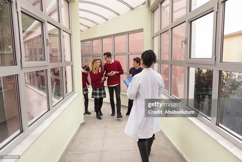 Turkish Students and Teacher Comming Together in School Hallway, Istanbul