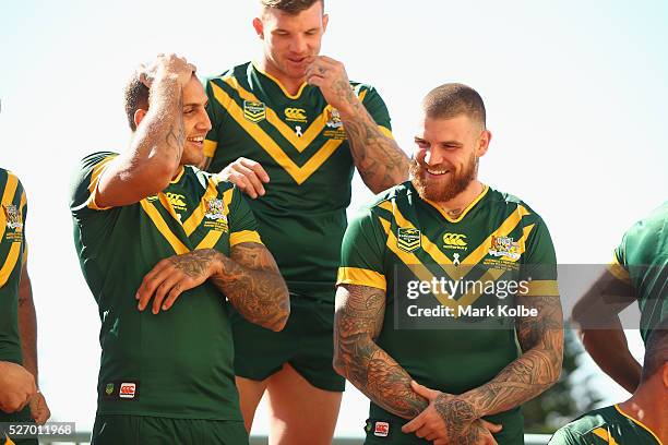 Blake Ferguson, Josh McGuire and Josh Dugan share a joke as they pose for the team photo during the Australia Kangaroos Test team photo session at...