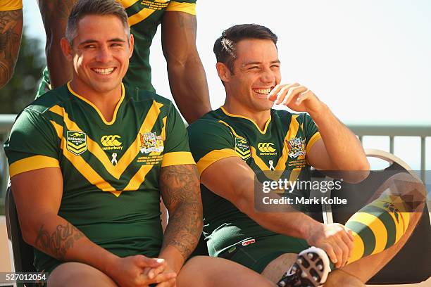 Corey Parker and Cooper Cronk share a joke as they pose for the team photo during the Australia Kangaroos Test team photo session at Crowne Plaza...