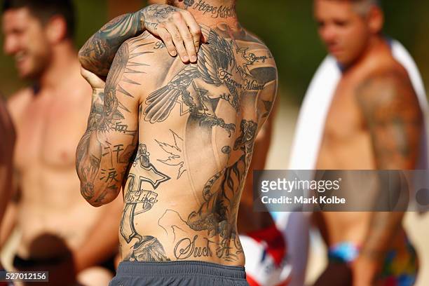 The tattoos of Josh Dugan are seen during the Australia Kangaroos Test team recovery session at Coogee Beach on May 2, 2016 in Sydney, Australia.