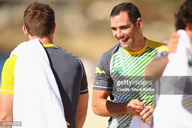 Cameron Smith shares a laugh with a team mate during the Australia Kangaroos Test team recovery session at Coogee Beach on May 2, 2016 in Sydney,...
