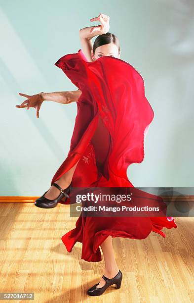 woman dancing in red dress - tango dancers foto e immagini stock