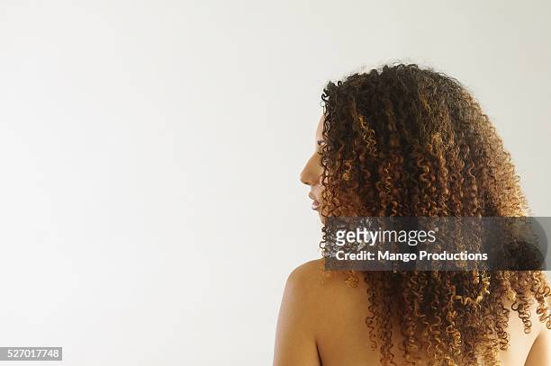 young brunette woman - curly hair back stock pictures, royalty-free photos & images