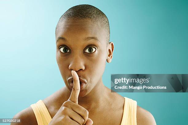 woman with fingers on lips - shh stock pictures, royalty-free photos & images