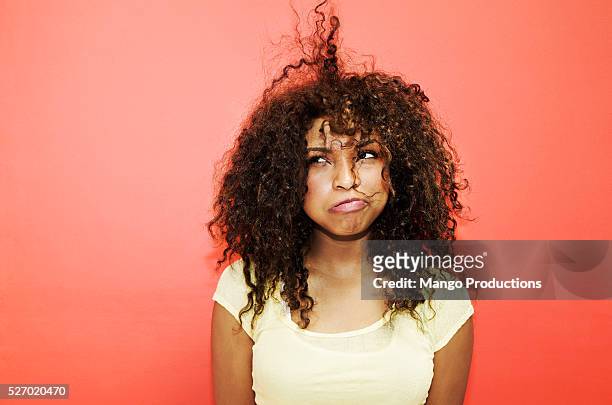 young woman having bad hair day - frustrazione foto e immagini stock