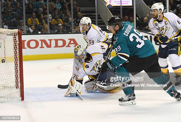 Logan Couture of the San Jose Sharks scores a goal past Pekka Rinne of the Nashville Predators in Game Two of the Western Conference Second Round...
