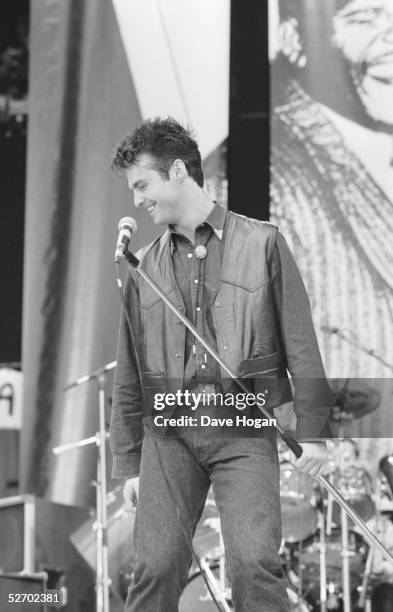 Singer Marti Pellow of pop group Wet Wet Wet performing at the 70th birthday tribute concert for imprisoned South African leader Nelson Mandela, held...