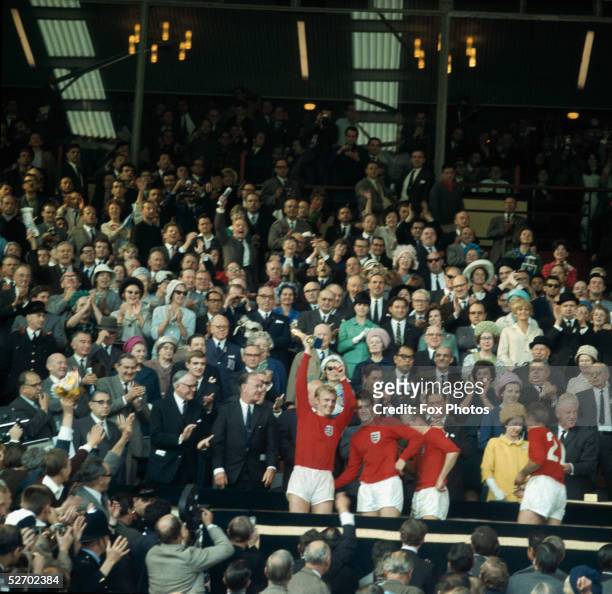 Captain Bobby Moore holds the Jules Rimet trophy aloft following Englands 4 -2 victory against West Germany in the the World Cup Final at Wembley...