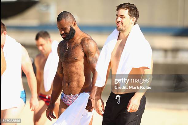 Semi Radradra and Aidan Guerra walk to the water during the Australia Kangaroos Test team recovery session at Coogee Beach on May 2, 2016 in Sydney,...