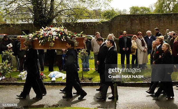 Hayley Mills, her brother Jonathan, and sister Juliette, follow their father's coffin, actor Sir John Mills, during his funeral service, at the...