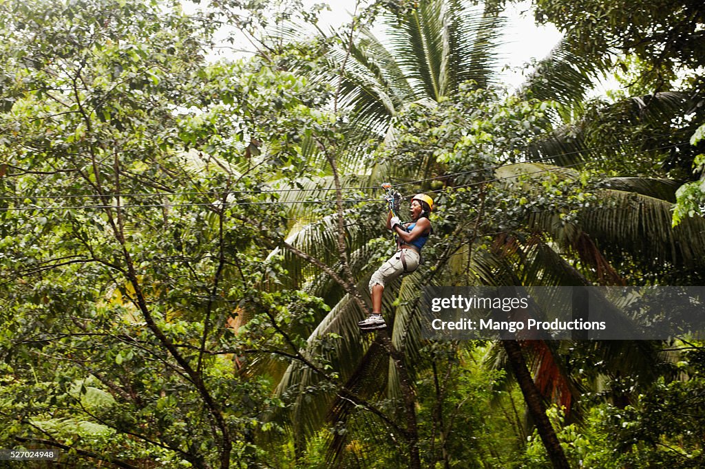 Woman Ziplining in the Jungle