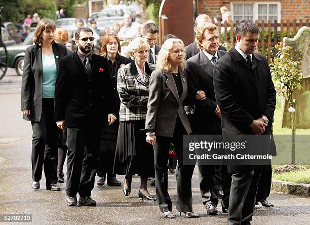 The family of Sir John Mills arrive at his funeral service on April 27, 2005 in Denham.