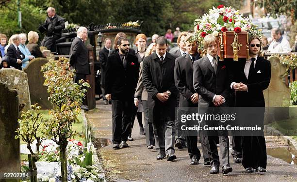 The coffin of Sir John Mills is carried into The Parish Curch of Saint Mary the Virgin on April 27, 2005 in Denham.