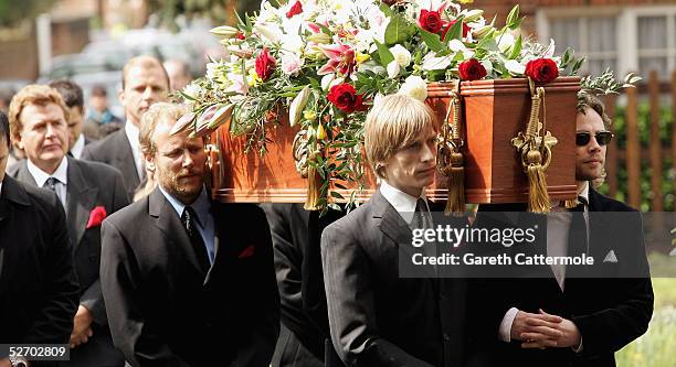 Pall bearers, including grandson Crispian Mills carry the coffin of Sir John Mills into The Parish Curch of Saint Mary the Virgin on April 27, 2005...