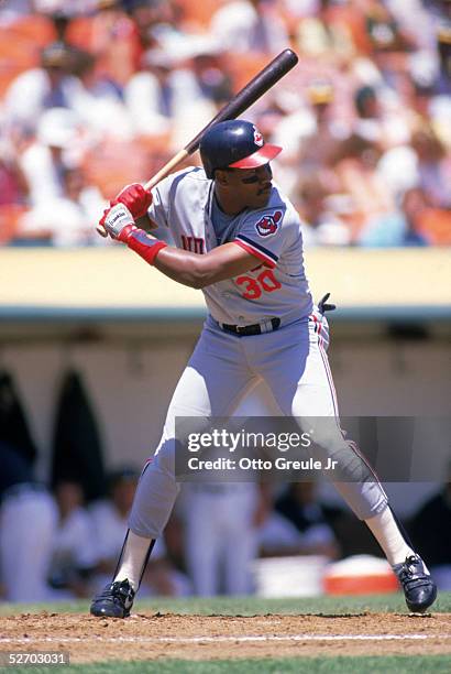 Joe Carter of the Cleveland Indians waits for the pitch during a 1988 game against the Oakland Athletics at Oakland-Alameda Coliseum in Oakland,...