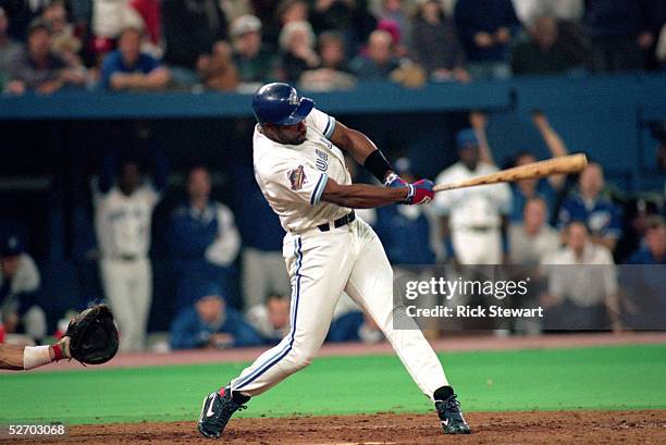 Joe Carter of the Toronto Blue Jays hits a game winning three-run home run against the Philadelphia Phillies in game six of the 1993 World Series at...