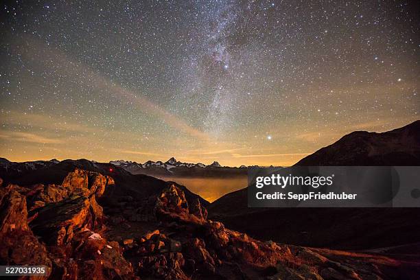 night light and milky way swiss alps - schreckhorn stock pictures, royalty-free photos & images