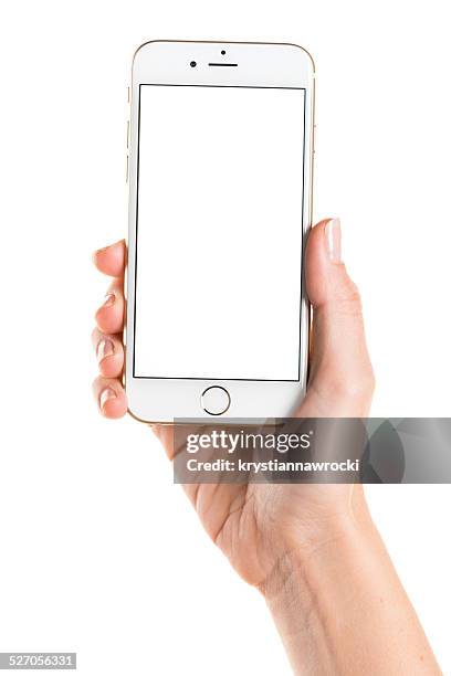 holding gold iphone 6 with white screen - iphone stockfoto's en -beelden