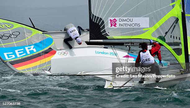 Olympics Sailing Weymouth Mens 49er Class Skiff Germanys Tobias Schadewaldt and Hannes Baumann capsize during the fleet race