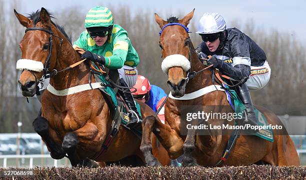 View of Joe Tizzard riding Third Intention to 2nd place and Jason Maguire riding Super Duty in the Mildmay Novices' Chase on the second day of The...