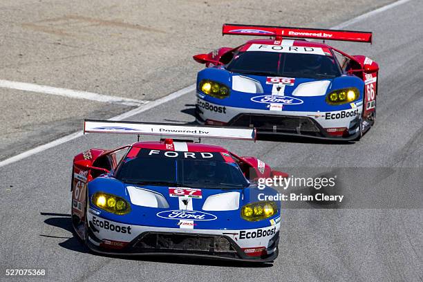 The Ford GT of Ryan Briscoe and Richard Westbrook leads the Ford GT of Dirk Muller and Joey Hand during the IMSA WeatherTech Series race at Mazda...