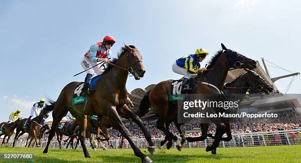 View of horses and riders coming up to the finish in the Gordon's Handicap Stakes during the Glorious Goodwood Race of Champions Meeting at Goodwood...