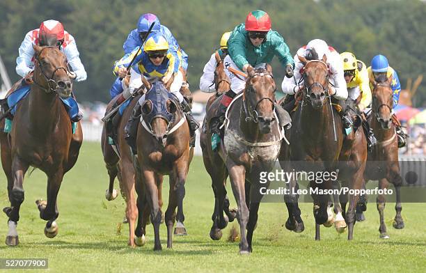 View of horses and riders competing at the finish in the Gordon's Handicap race during the Glorious Goodwood Race of Champions Meeting at Goodwood...