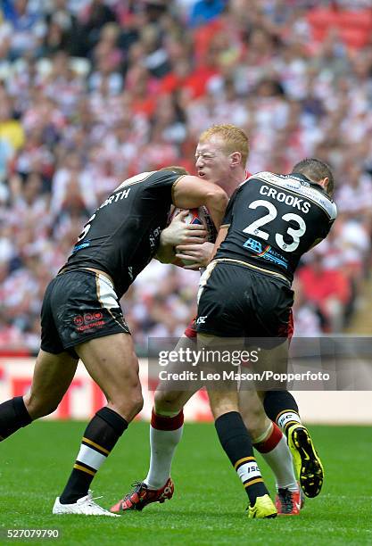 Tetleys Challenge Rugby League Final Wembley Stadium UK Hull FC v Wigan Warriers Wigan's Liam Farrell being tackled