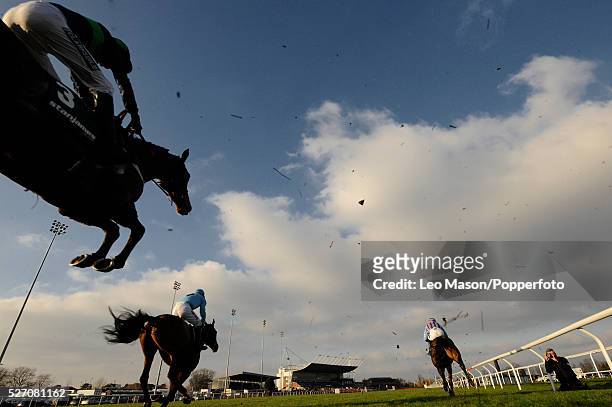 View of horses and riders competing in the Stanjamesuk.com Handicap Hurdle during the 2008 Stan James Christmas Festival at Kempton Park racecourse...