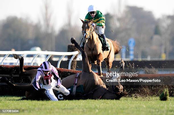 Pierrot Lunaire and Ruby Walsh fall at the last fence, with Straw Bear and Tony McCoy behind, during the Stan James Christmas Hurdle Race at the 2008...
