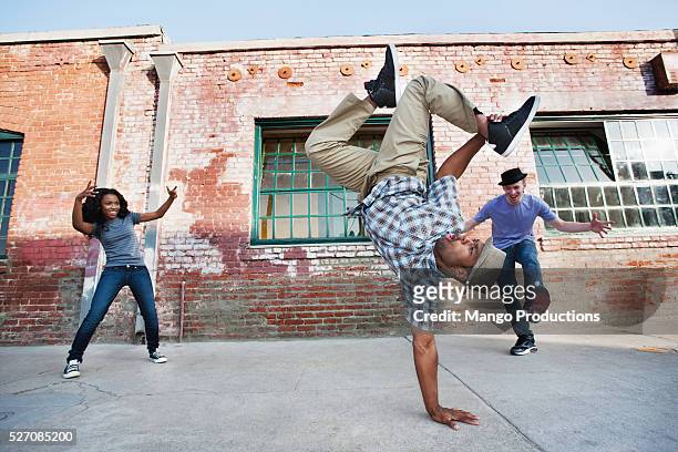 young man doing handstand - street dance stock pictures, royalty-free photos & images