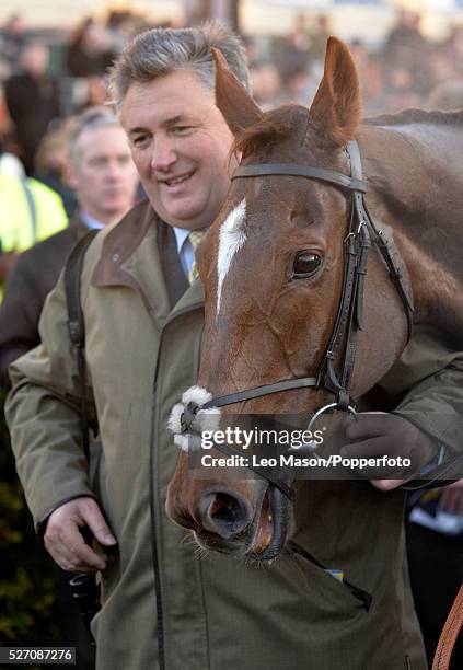 View of the racehorse Silviniaco Conti, ridden by jockey Noel Fehily, pictured in the unsaddling enclosure with trainer Paul Nichols after finishing...