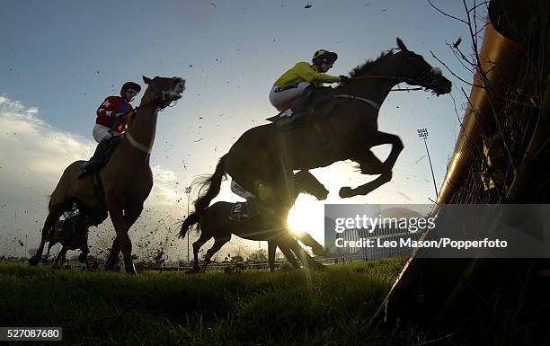 View of horses and riders competing in the williamhill.com Desert Orchid Chase race during the William Hill Winter Festival Meeting at Kempton Park...