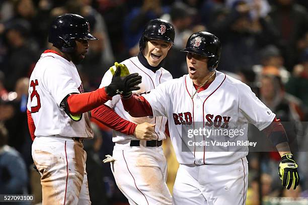 Christian Vasquez of the Boston Red Sox returns to the dugout after hitting a two-run home run in the seventh inning during the game against the New...