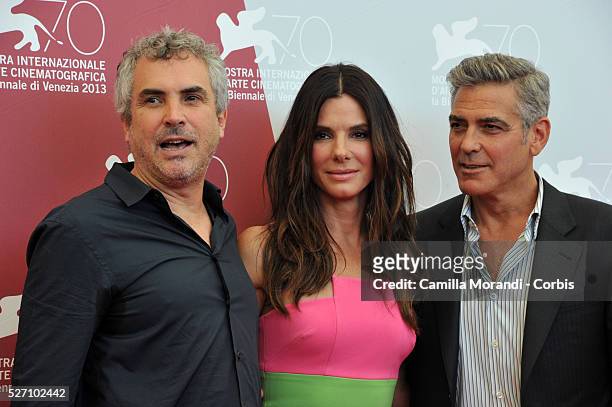 Venice Film Festival Alfonso Cuaron, George Clooney and Sandra Bullock during the photocall of the film Gravity