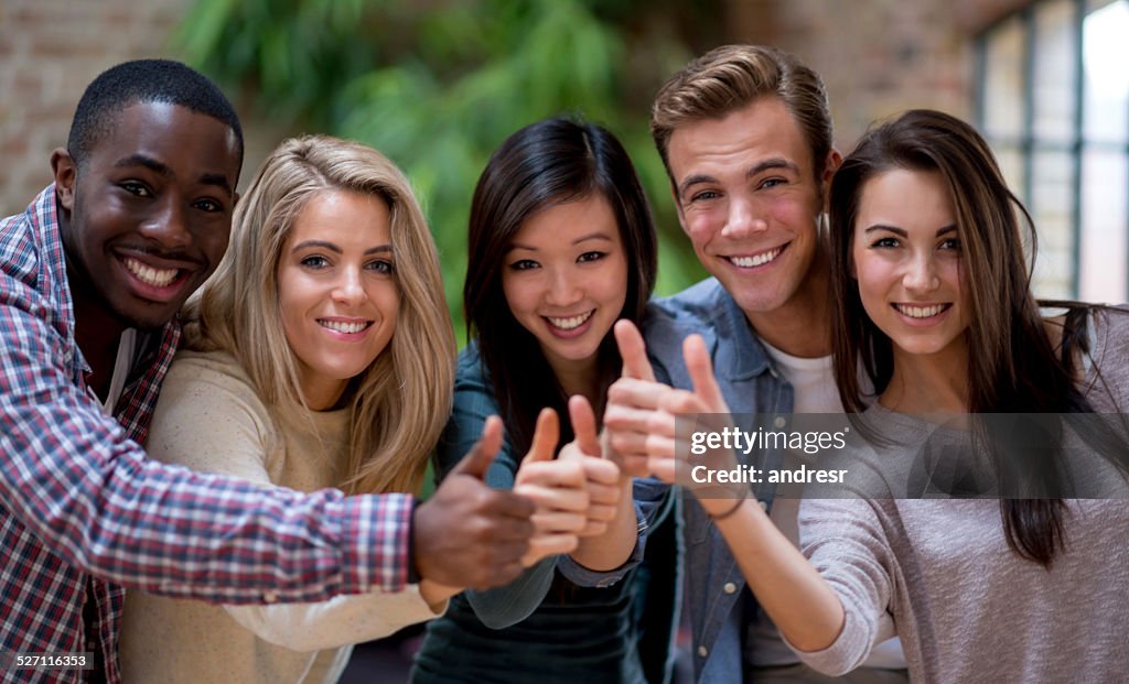 Group of friends with thumbs up