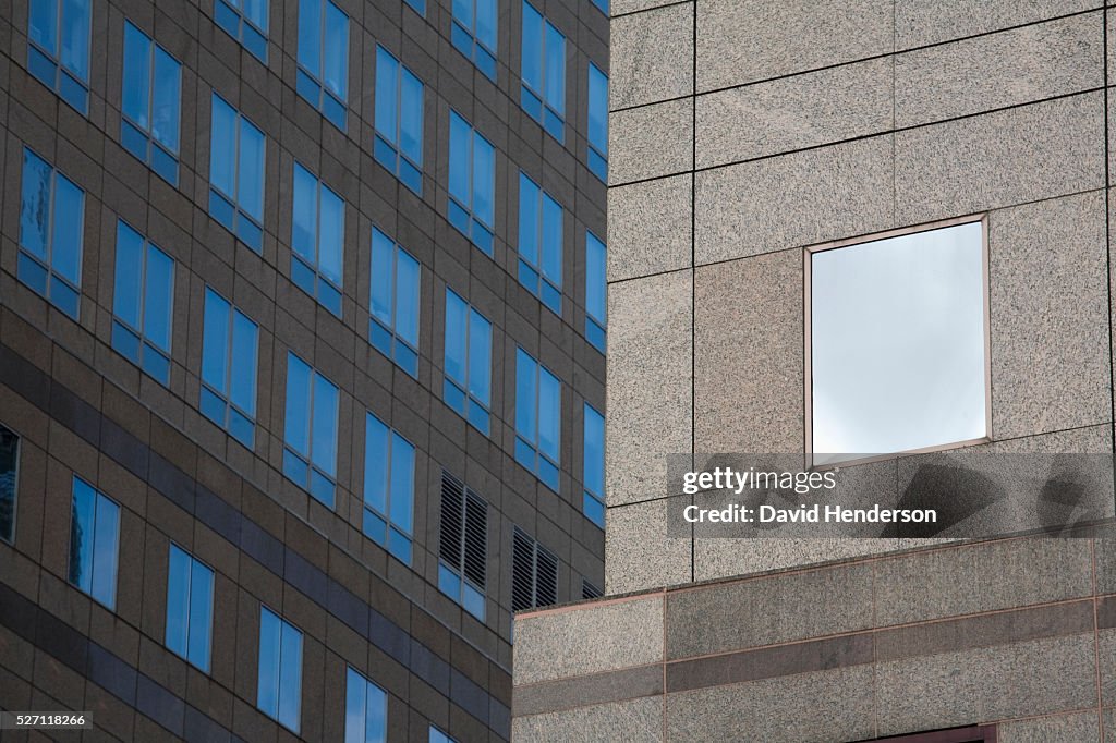 Beige granite skyscraper with glass windows