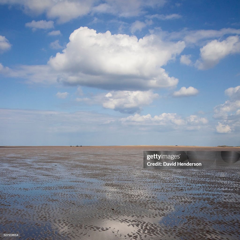 Cloud reflecting in shallow water